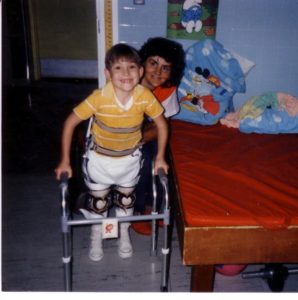 My mom and I at Shriners Hospital. I am standing in my reciprocating braces